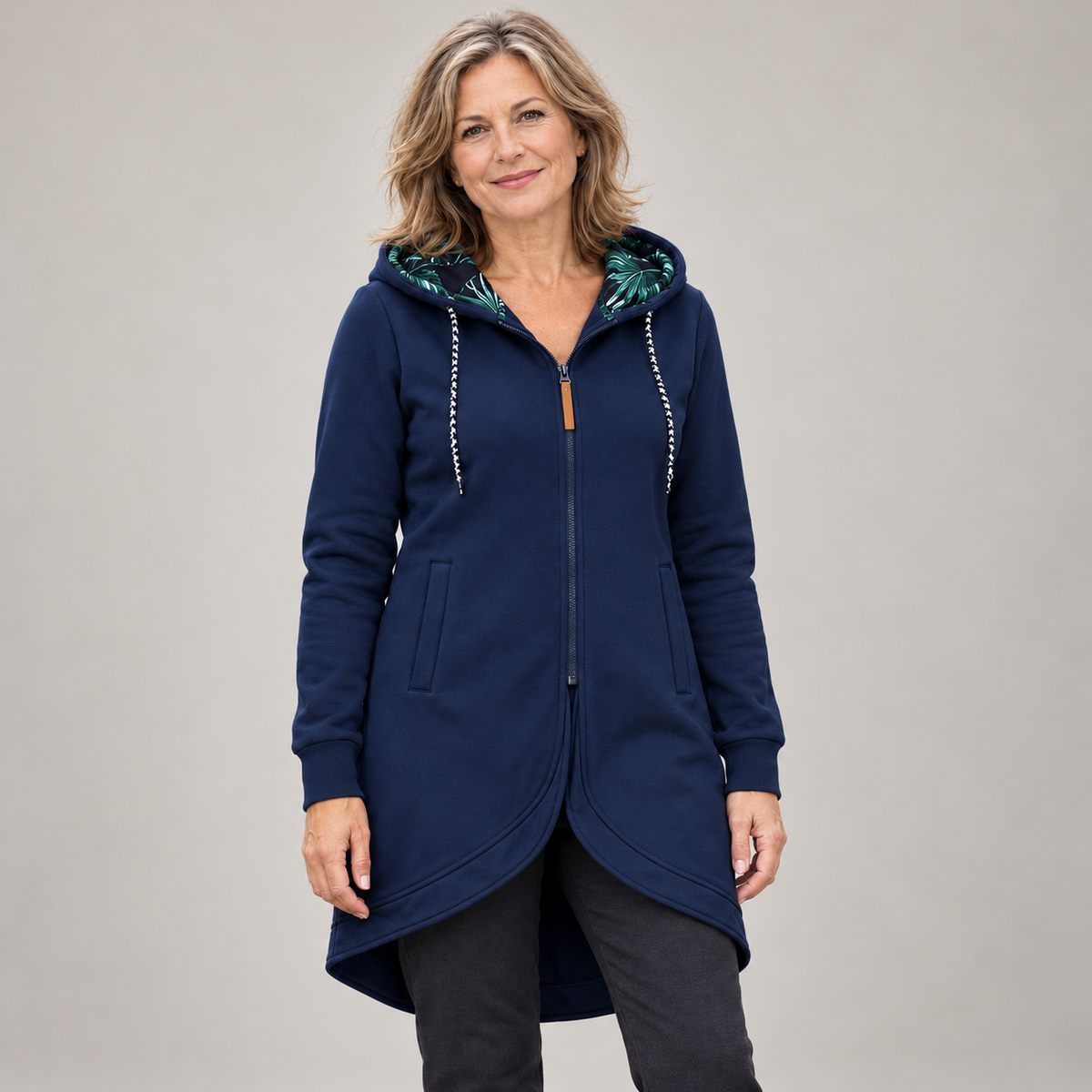 Maren long zip jacket – blue, worn zipped with the leaf-print hood lining showing