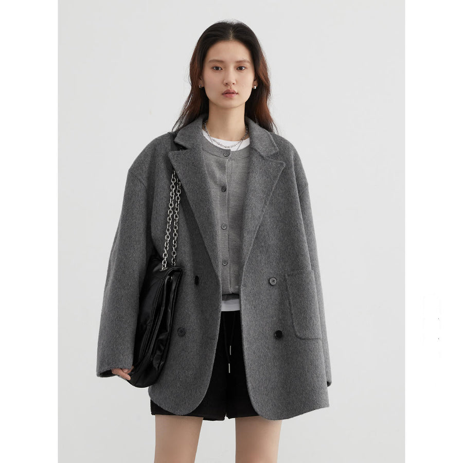Agathe wool coat – grey, worn open over a grey cardigan