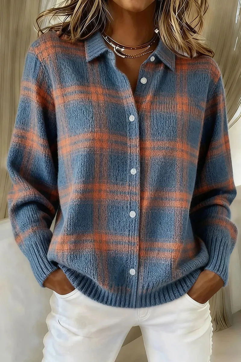 Maud brushed plaid knit overshirt in blue and orange, buttoned to the collar and worn over white jeans, hands in the pockets.