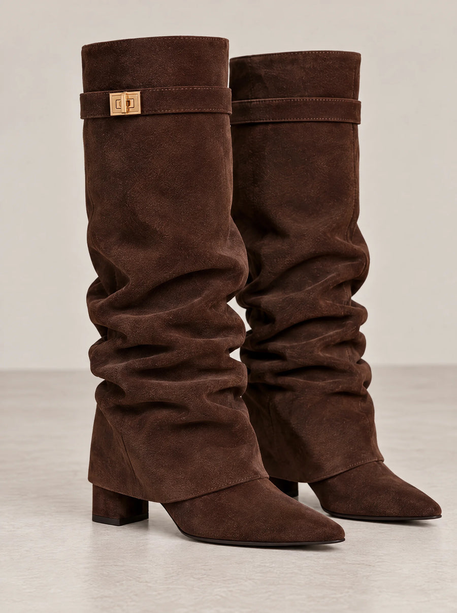 In brown: the gold-tone turn-lock strap at the top