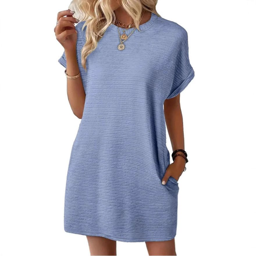 Nora textured T-shirt dress in light blue, with a hand in the side pocket