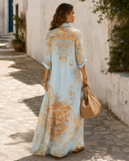 The back of the pale blue dress, showing the baroque border across the shoulders and a plain panel down the centre back.