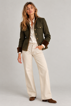 Full length, with wide-leg cream jeans and suede boots
