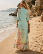 Back view of the Juliette shirt dress, showing butterflies scattered at the shoulder and the floral border at the hem