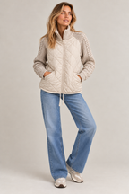 Lena quilted jacket – cream, full-length view with jeans