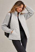 Lena quilted jacket – grey, worn open over a black top