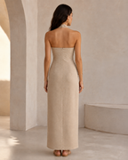 Back view of the Noelle dress in khaki, showing the open back, halter neck band and centre-back seam
