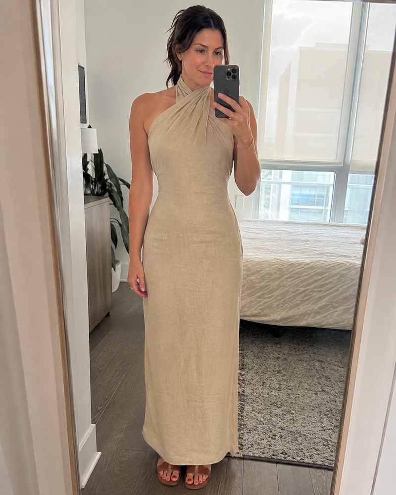 Customer photo: mirror selfie in the Noelle dress in khaki, hem to the floor with flat sandals
