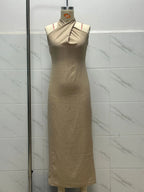 The Noelle dress on a dressform, front: crossover halter neckline and straight skirt