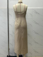 The Noelle dress on a dressform, back: plain seamed back with a concealed zip at the top