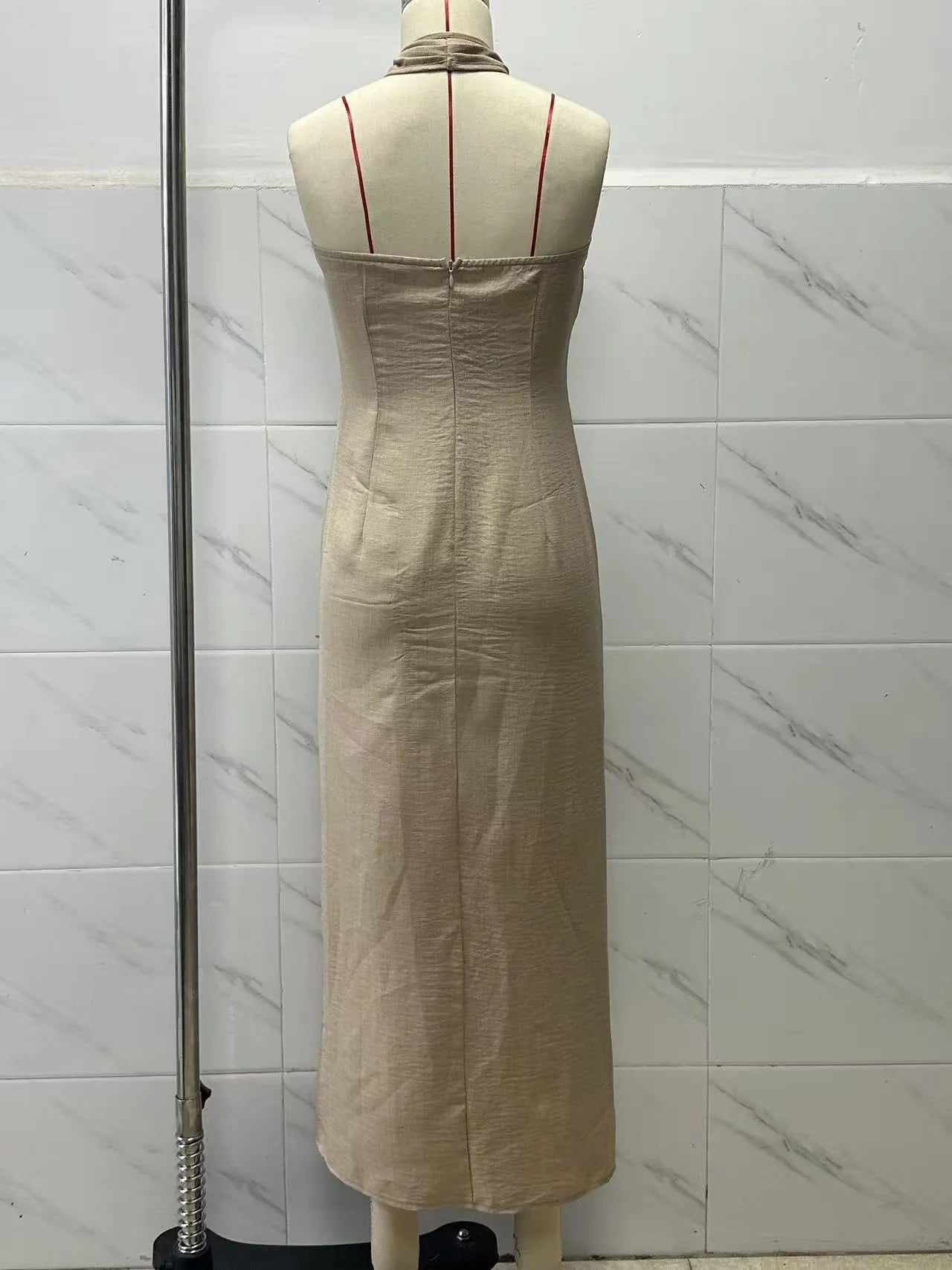 The Noelle dress on a dressform, back: plain seamed back with a concealed zip at the top