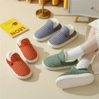 Pluffy slippers in Grey, Pumpkin, Pink and Sage, one pair worn with white socks
