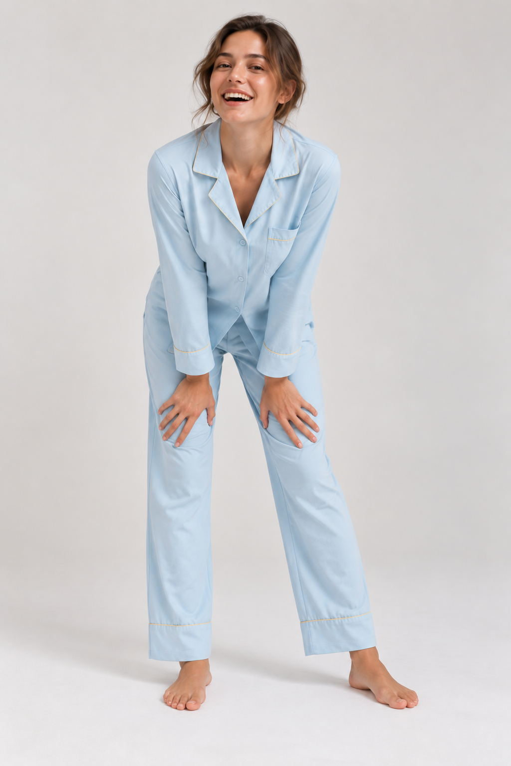 Woman laughing in the Still Nights Modal Sleep Set in Powder Blue, relaxed fit