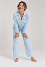 Woman laughing in the Still Nights Modal Sleep Set in Powder Blue, relaxed fit